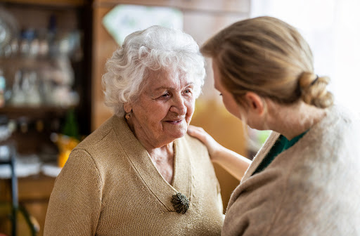 Senior women talking to daughter about moving into senior community